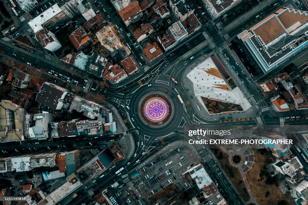 Top down view of a Slavia Square roundabout in Belgrade, with it's singing fountain, taken from a drone