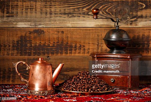 coffee still life with beans and grinder - copper still stockfoto's en -beelden