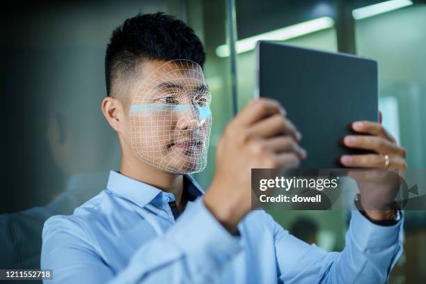 facial recognition with business man - biometrics stock pictures, royalty-free photos & images