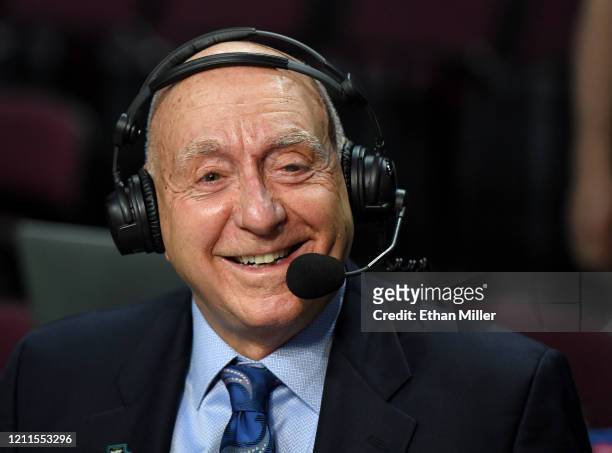 Sportscaster Dick Vitale broadcasts before a semifinal game of the West Coast Conference basketball tournament between the San Francisco Dons and the...