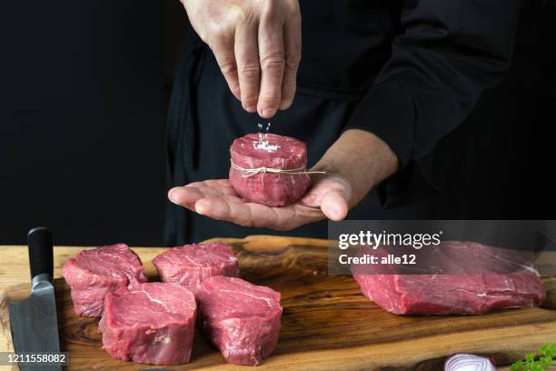 chef salting beefsteak - serving size stock pictures, royalty-free photos & images