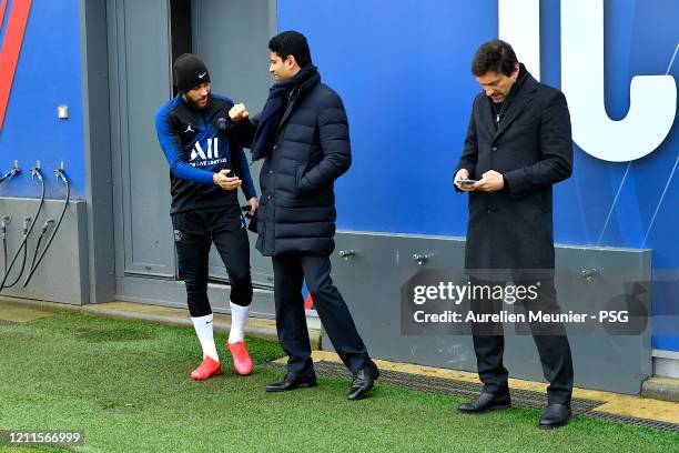 The President of the Paris Saint-Germain Nasser Al Khelaifi and the sport Director Leonardo salute Neymar Jr before a training session at Ooredoo...