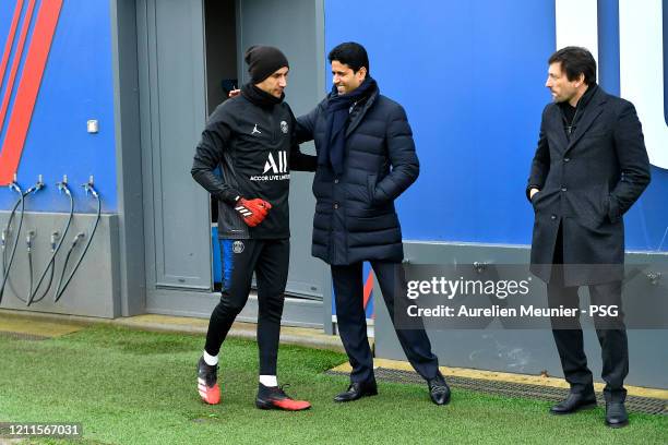 The President of the Paris Saint-Germain Nasser Al Khelaifi and the sport Director Leonardo salute Keylor Navas before a training session at Ooredoo...