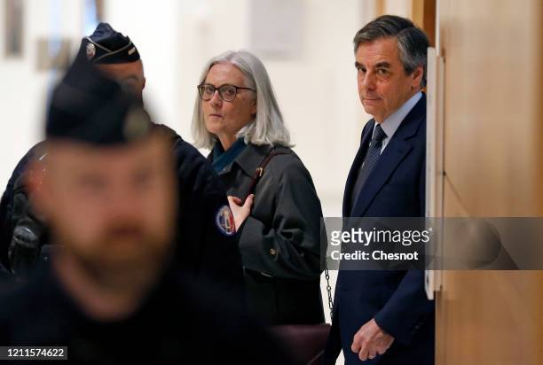 Former French Prime Minister Francois Fillon and his wife Penelope Fillon arrive for their trial at the courthouse on March 10 2020 in Paris, France....
