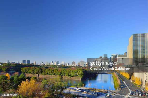 marunouchi cityscape view - imperial palace tokyo stock-fotos und bilder