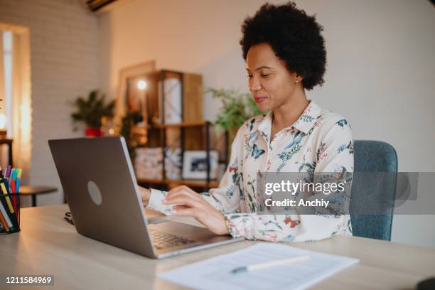 woman working from home office - dominican republic stock pictures, royalty-free photos & images