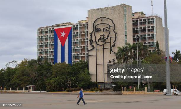 May 2020, Cuba, Havanna: A man with a face mask walks across the emblematic "Plaza de la Revolucion", which is empty due to the suspension of the...