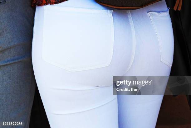 butt of a woman in white pants - white pants stock pictures, royalty-free photos & images