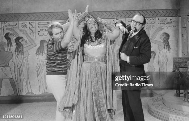 Comedians Eric Morecambe and Ernie Wise in a sketch with actress Janet Webb for the BBC television series 'The Morecambe and Wise Show', June 10th...