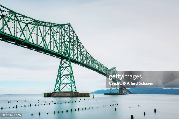 long exposure of the astoria-megler bridge in astoria oregon usa - columbia river stock pictures, royalty-free photos & images