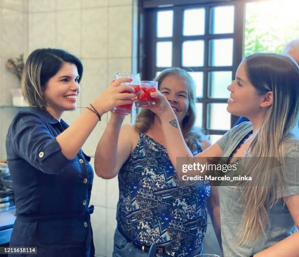 weekend lunch with family, a delicious feijoada with caipirinha. - caipirinha stock pictures, royalty-free photos & images