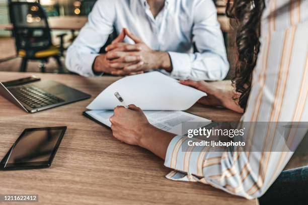 business people negotiating a contract - sales meeting stock pictures, royalty-free photos & images