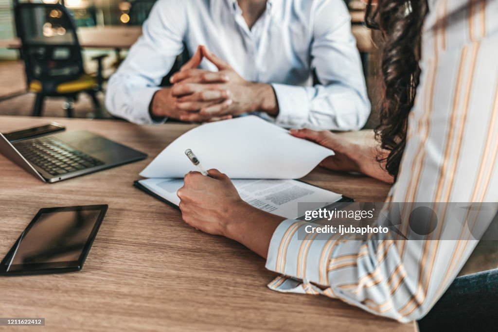 Business people negotiating a contract