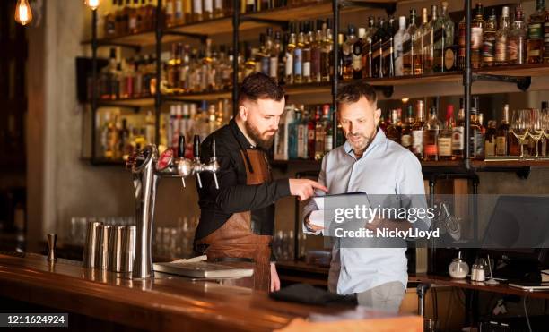 keeping track of the stock - restaurant manager stock pictures, royalty-free photos & images