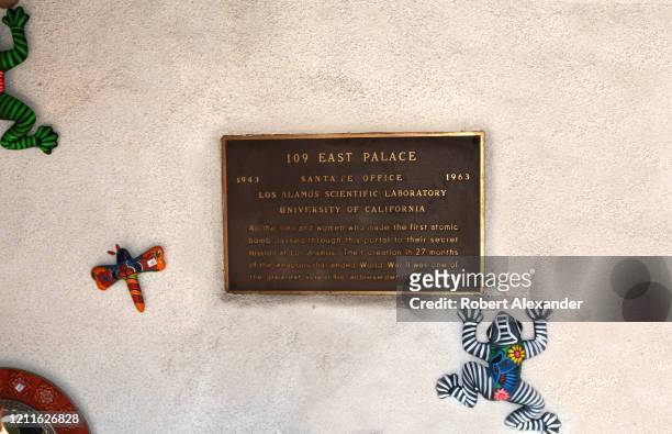 Metal plaque on a building in Santa Fe, New Mexico, near the entrance to 109 Palace Avenue, identifies a room which was the first stop and check-in...