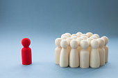 A Manager or Leader addressing a group of people or being isolated because of diversity