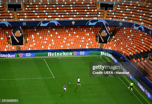 In this handout image provided by UEFA, General view inside the empty stadium during the UEFA Champions League round of 16 second leg match between...