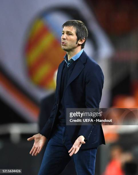 In this handout image provided by UEFA, Albert Celades head coach of Valencia reacts during the UEFA Champions League round of 16 second leg match...