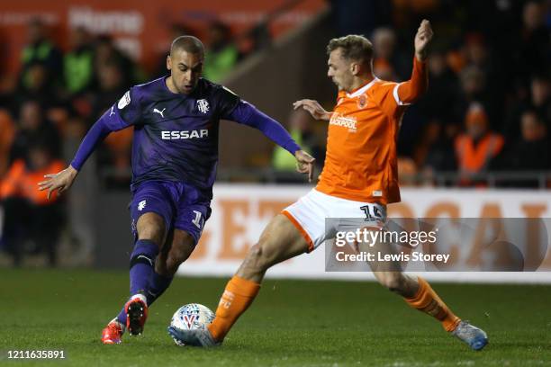 James Vaughan of Tranmere Rovers is tackled by Kiernan Dewsbury-Hall of Blackpool during the Sky Bet League One match between Blackpool and Tranmere...