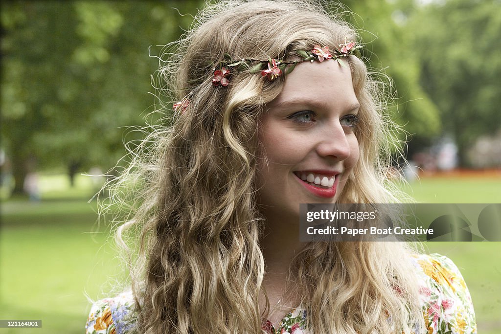 Festival flower girl smiling in the park
