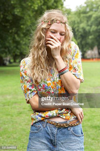 blonde giggling girl in the park - floral pattern pants stock pictures, royalty-free photos & images