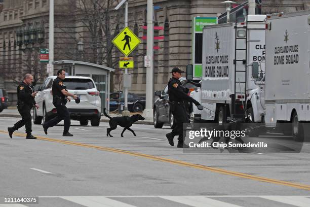 Members of the Cleveland Police Department bomb squad and their K9 dogs leave after Democratic presidential candidate Sen. Bernie Sanders canceled...