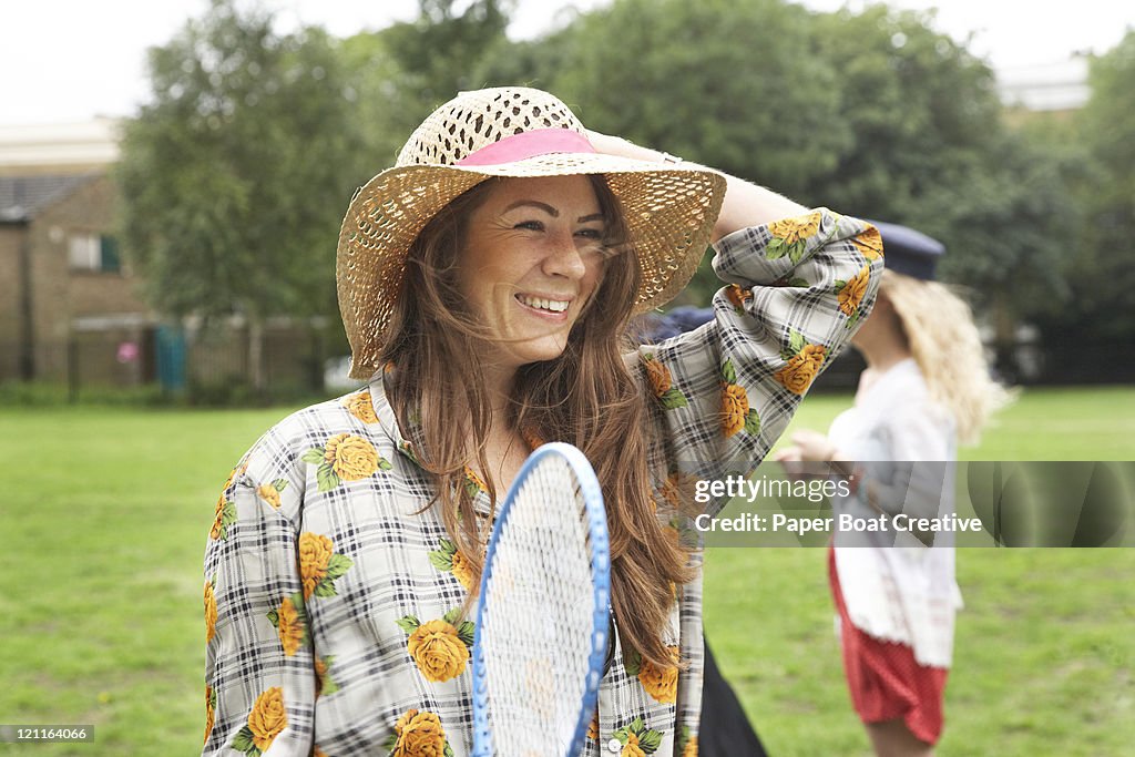 Lady playing badminton in the park