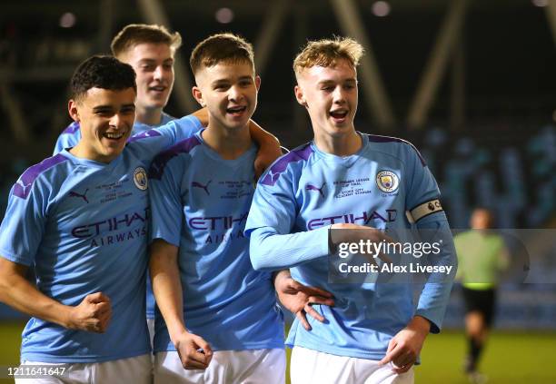 Cole Palmer of Manchester City celebrates with team mates after scoring their sixth goal from the penalty spot during the Premier League Cup Final...