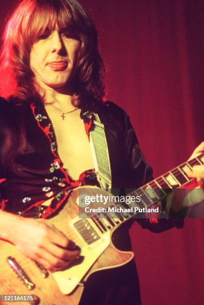 Mick Ralphs of Bad Company performs on stage, circa 1975. He plays a Gibson Les Paul guitar.