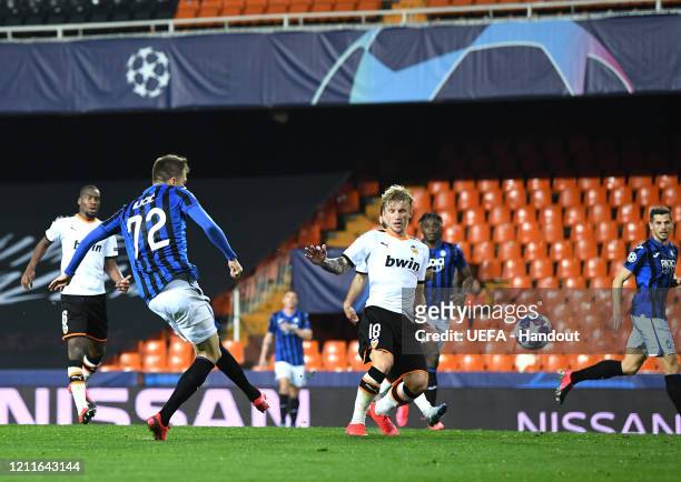 In this handout image provided by UEFA, Josip Ilicic of Atalanta scores his sides fourth goal during the UEFA Champions League round of 16 second leg...