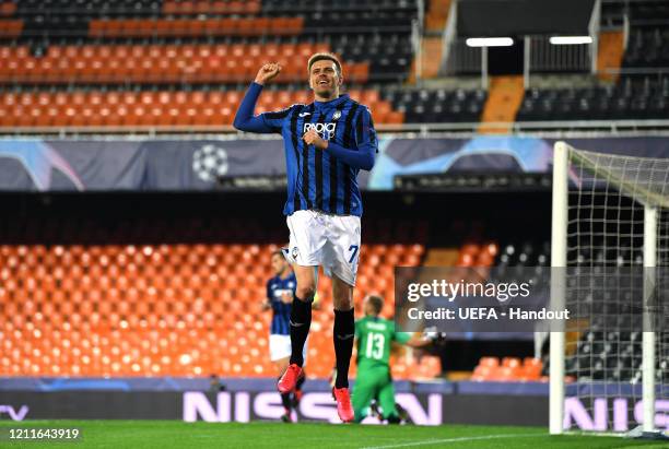 In this handout image provided by UEFA, Josip Ilicic of Atalanta ceebrates after he scores his sides fourth goal during the UEFA Champions League...