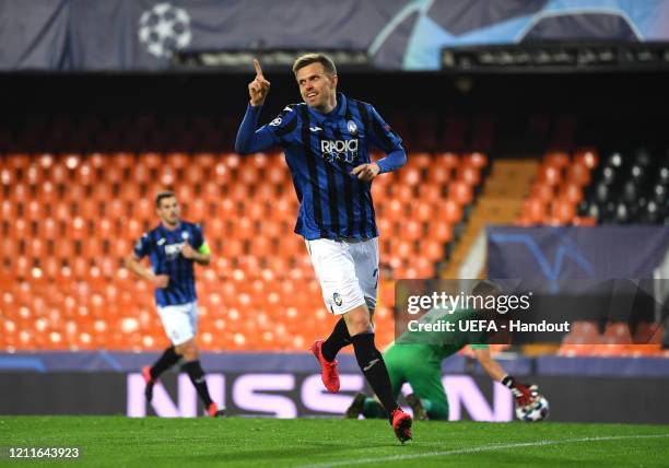 In this handout image provided by UEFA, Josip Ilicic of Atalanta ceebrates after he scores his sides fourth goal during the UEFA Champions League...