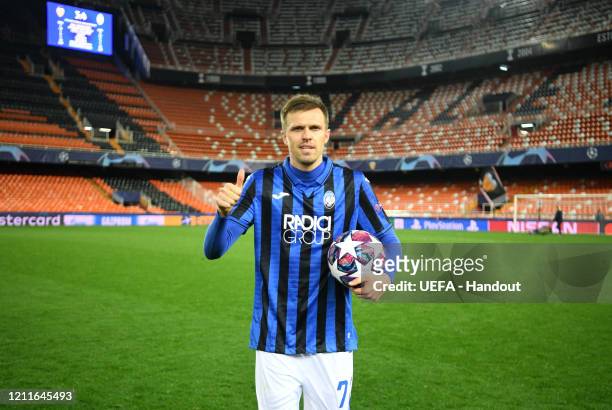 In this handout image provided by UEFA, Josip Ilicic of Atalanta poses with the match ball after he scores all 4 goals of the match for his team...