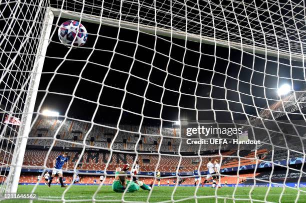 In this handout image provided by UEFA, Josip Ilicic of Atalanta scores his sides third goal past Jasper Cillessen of Valencia during the UEFA...