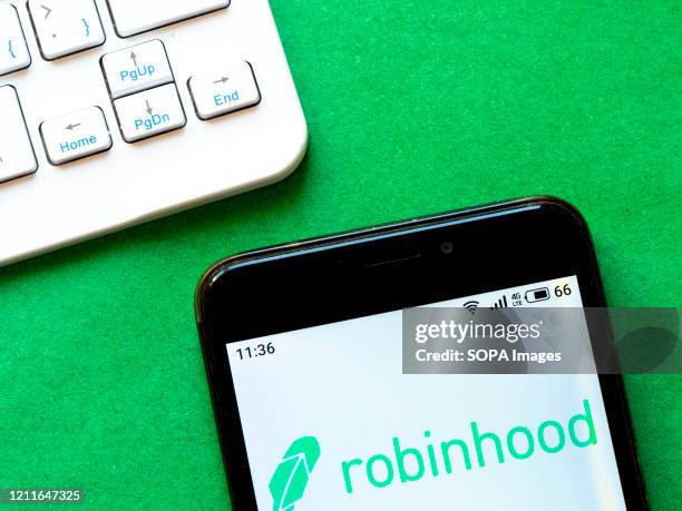 In this photo illustration a Robinhood logo seen displayed on a smartphone.