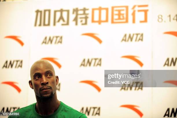 Kevin Garnett of the Boston Celtics talks to the media after arriving at Baiyun Airport on August 14, 2011 in Guangzhou, Guangdong Province of China.