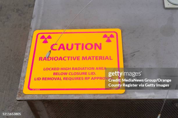 Caution sign sits on one of the Holtec HI-STORM UMAX dry storage containers at the shuttered San Onofre Nuclear Generating Station south of San...