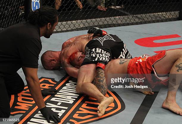 Chris Lytle secures a guillotine choke against Dan Hardy during a welterweight bout at the UFC on Versus 5 event at the Bradley Center on August 14,...