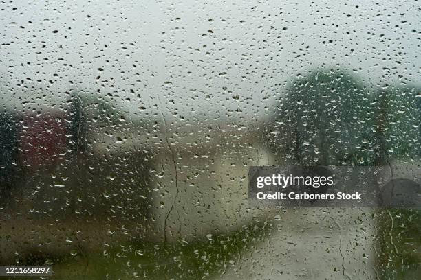 rain drops on a window pane - bad weather on window stock pictures, royalty-free photos & images