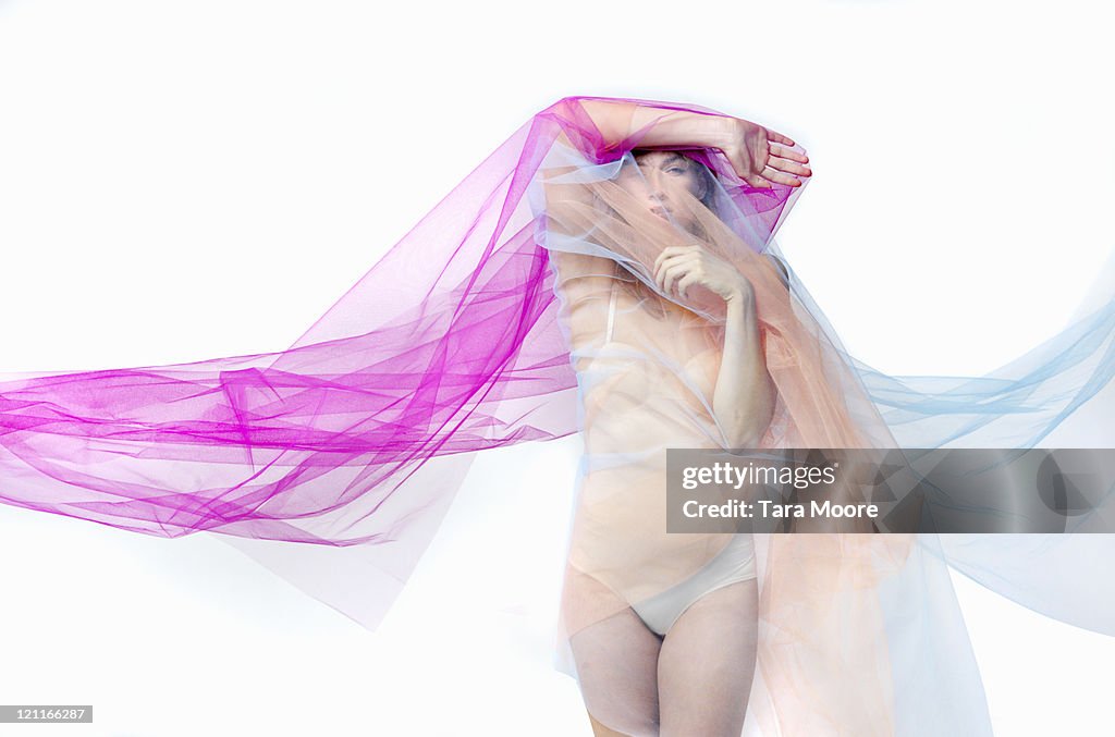 Woman covered with bright material