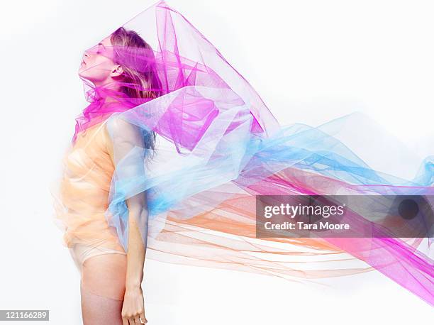 woman covered with bright colorful material - durchsichtig kleidung frau stock-fotos und bilder