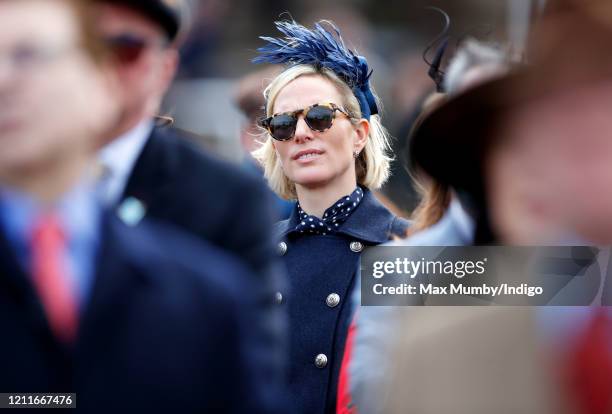 Zara Tindall watches the racing as she attends day 1 'Champion Day' of the Cheltenham Festival 2020 at Cheltenham Racecourse on March 10, 2020 in...