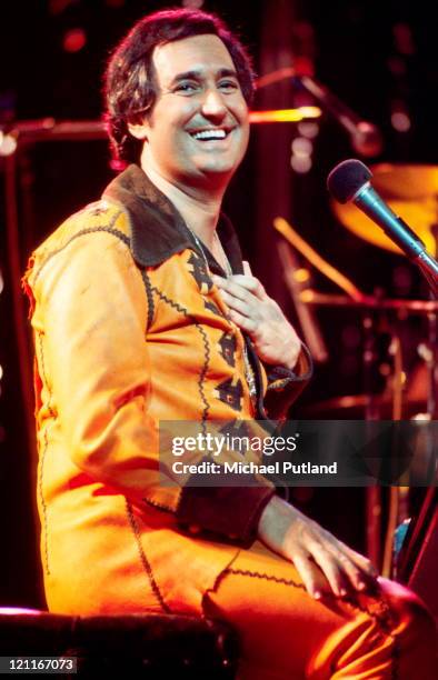 Neil Sedaka performs on stage, London, April 1977.