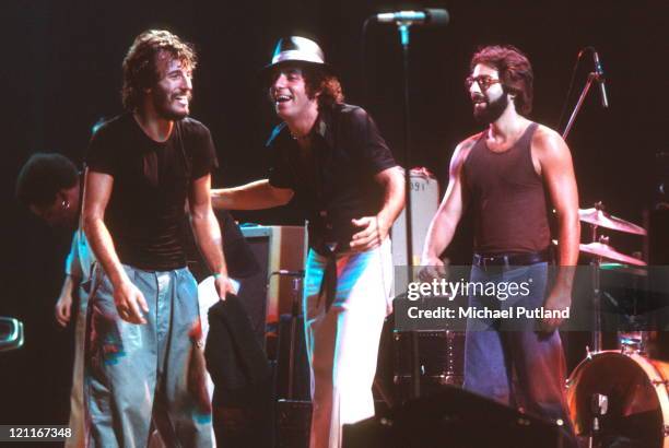 Bruce Springsteen performs on stage with Steven Van Zandt and Max Weinberg of the E Street Band at the Hammersmith Odeon in London, England on...