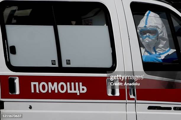 Patients suspected of the coronavirus infection are brought by health officials wearing protective gear with ambulances to Kommunarka Hospital in...
