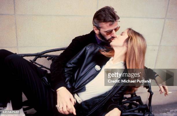 Ringo Starr, formerly of the Beatles, kissing his wife Barbara Bach, London, 1981.