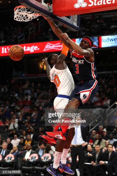 Bradley Beal of the Washington Wizards dunks on Julius Randle of the New York Knicks during the second half at Capital One Arena on March 10, 2020 in...