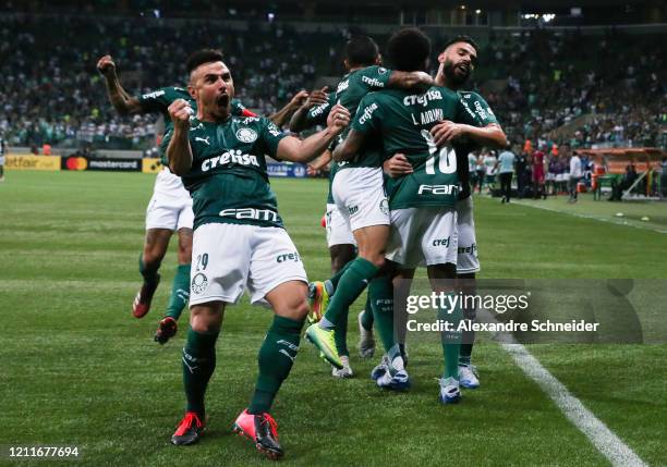 Luiz Adriano of Palmeiras celebrates with teammates after scoring the first goal of his team during the match against Guarani PAR for the Copa...