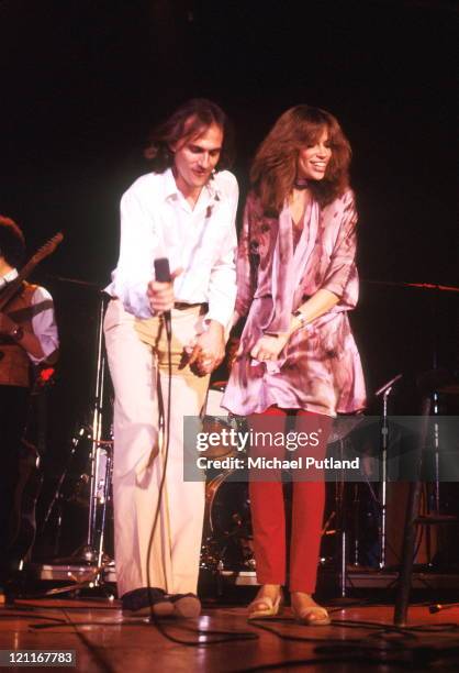 James Taylor and Carly Simon perform on stage, New York, April 1978.