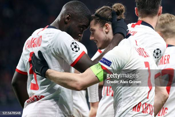 Marcel Sabitzer of Leipzig celebrates his team's second goal with team mate Dayot Upamecano during the UEFA Champions League round of 16 second leg...